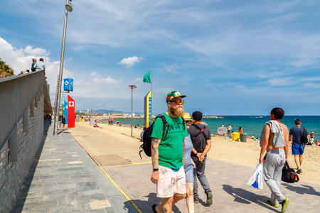 Barcelona, Spain - September 5, 2015: Barceloneta is one of the most popular city beaches of Barcelona. Many tourists come here to sunbathe, swim and play sports.のeditorial素材