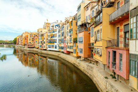 Yellow, red and orange facades of houses in Gironal. Spain, Catalonia.の写真素材