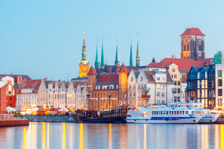 Gdansk, Poland - August 3, 2015: Multi-colored facades and boat on the central waterfront in Gdansk...
