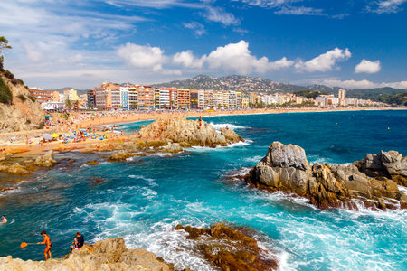 Lloret de Mar, Spain - September 13,  2015: A crowd of vacationers enjoy the warm beaches of the Costa Brava in Lloret de Mar. Lloret de Mar is one of the largest resorts on the coast of Spain.のeditorial素材
