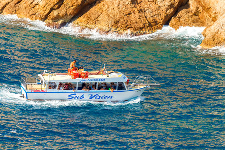Tossa de Mar, Spain - September 12, 2015: Tossa de Mar, Spain - September 12, 2015: Boat trip on  boat in the bay of Cala Bona. Picturesque places on the Costa Brava in Spain attracts many tourists from all over Europe.のeditorial素材