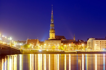 Evening view on the embankment of the Daugava River and the spiers of churches in Riga.の写真素材