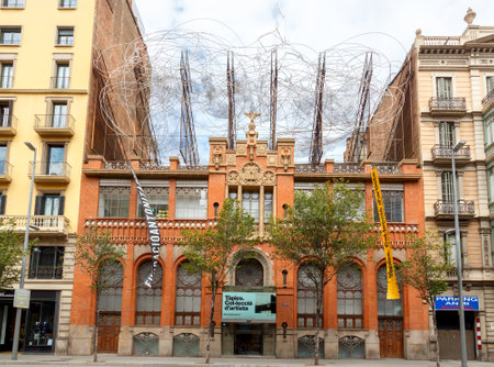 Barcelona, Spain - September 6, 2015: House with the composition of the wire on the roof of the cloud and chair. The work Antoni Tape. One of the attractions of Barcelona.のeditorial素材