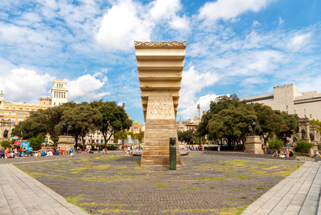 Barcelona, Spain - September 6, 2015: Tourists feed the pigeons in Plaza Catalunya in Barcelona. Plaza de Catalunya is one of the main attractions of the Spanish capital.のeditorial素材