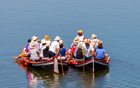 Florence, Italy - May 18, 2015: Water tourist boat trips on the river Arno. Local gondola are very popular among tourists.のeditorial素材