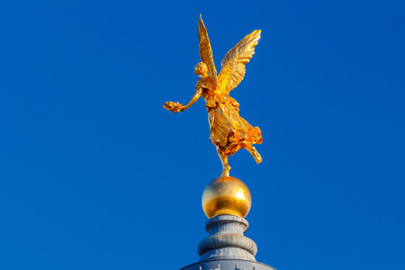 Golden statue on the dome of the Academy of Arts in Dresden.