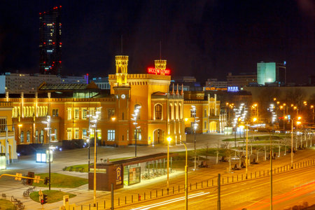 Wroclaw, Poland - December 23, 2015: Railway station in Wroclaw at night with lights. Wroclaw is a large transportation hub.のeditorial素材