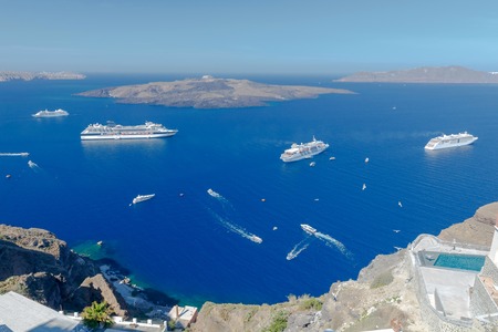 Passenger ships in the old port of Fira early sunny morning. Santorini. Greece.の写真素材