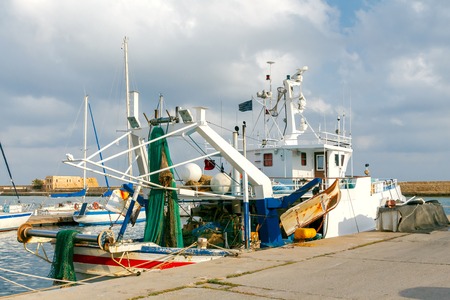 Fishing nets on the ship near the pier.の写真素材