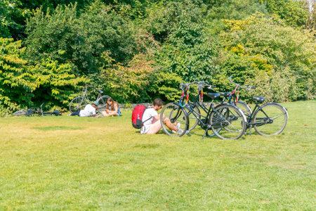 Amsterdam, The Netherlands - August 27, 2016: Vondelpark a favorite place for rest and walking residents and tourists. The park has good infrastructure for cyclists.のeditorial素材