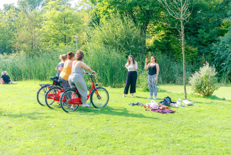 Amsterdam, The Netherlands - August 27, 2016: Vondelpark a favorite place for rest and walking residents and tourists. The park has good infrastructure for cyclists.のeditorial素材