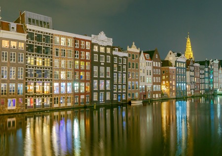 Facades of traditional Dutch houses on the canal in the night light. Amsterdam. Netherlands.の写真素材