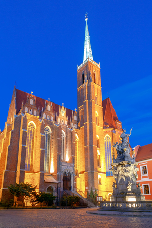 View of the Cathedral of St. John the Baptist on the island Tumski in Wroclaw on the sunset. Poland.の写真素材