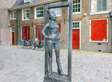Amsterdam. Netherlands - August 26, 2016: Monument prostitute Bella about the oldest church in the red-light district. Amsterdam, Netherlands.のeditorial素材