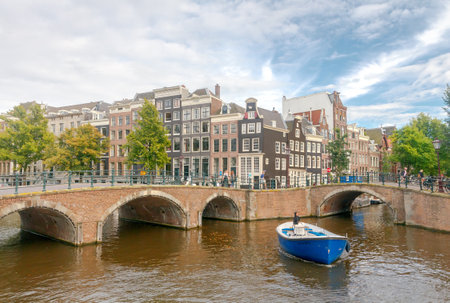 Amsterdam, The Netherlands - August 28, 2016: Excursions by boat on the canals of Amsterdam. Favorite place for walking and leisure travelers.のeditorial素材