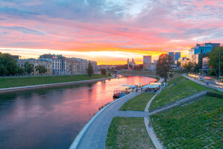 Scenic view of the embankment of the Neris River in Vilnius at sunset.