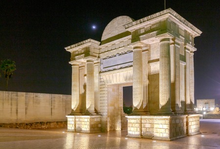Ancient Roman triumphal arch in Cordoba at night. Spain. Andalusia.の写真素材