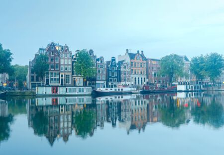 City Canal with glowing lights early in the morning. Amsterdam. Netherlands.の写真素材
