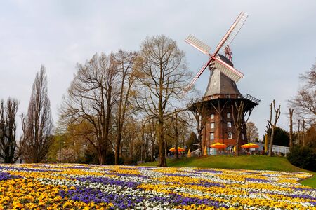 Park of rest Wallanlagen with an old mill in the city of Bremen. Germany.の写真素材