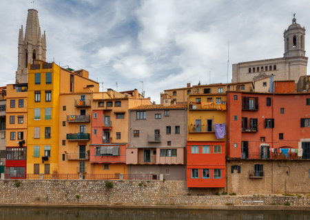 Yellow, red and orange facades of houses in Gironal. Spain, Catalonia.
