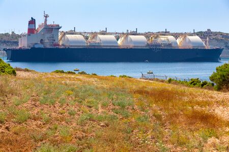 Huge tanker gas carrier at the berth of a power station on the island Malta. Marsaxlokk.の写真素材