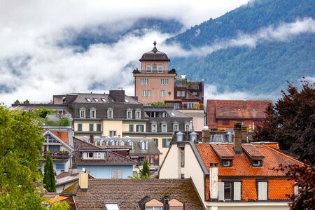 Interlaken. Aerial view of the city rooftops and mountains.の写真素材