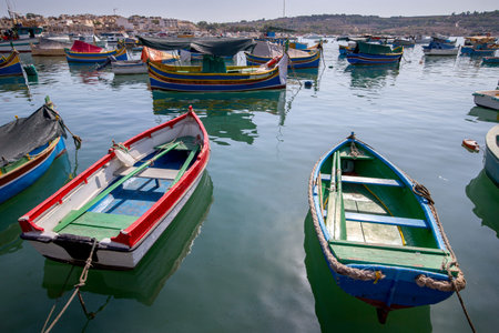 Traditional fishing boats called Luzzu in the bay of the village Marsaxlokk. Malta.