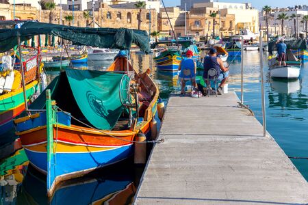 Marsaxlokk. Traditional boats Luzzu in the old harbor.の写真素材