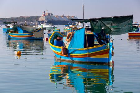 Marsaxlokk. Traditional boats Luzzu in the old harbor.の写真素材