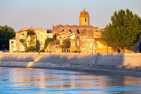 Arles. City embankment and facades of old houses.の写真素材