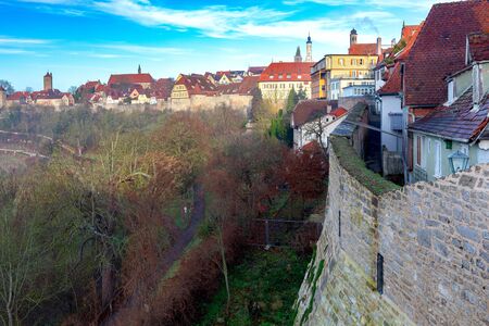 View of the stone towers and medieval buildings in the historic city. Rothenburg ob der Tauber. Bavaria Germany.の写真素材