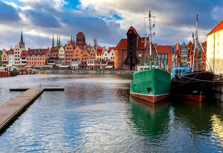City embankment and facades of medieval houses in the old city at dawn. Gdansk. Poland.の写真素材