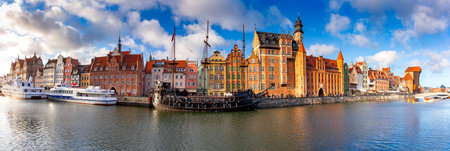 Panorama of the facades of old medieval houses on the promenade in Gdansk. Poland.