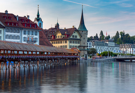 Scenic view of the Chapel, Kapellbrucke bridge, Wasserturm tower in the lantern light at sunrise....