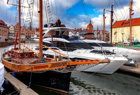 City embankment and facades of medieval houses in the old city at dawn. Gdansk. Poland.の写真素材