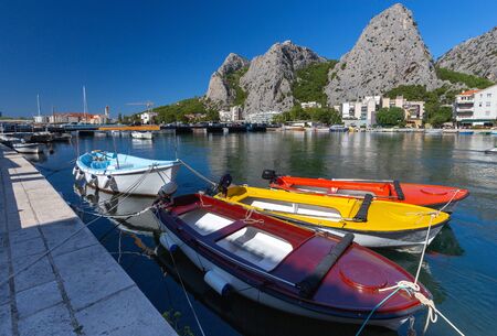 Boats in the fishing harbor at the mouth of the river. Omis. Croatia.の写真素材