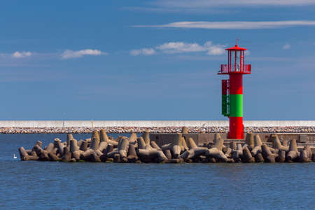 Swinoujscie. Lighthouse on a sunny day against the blue sky.の写真素材