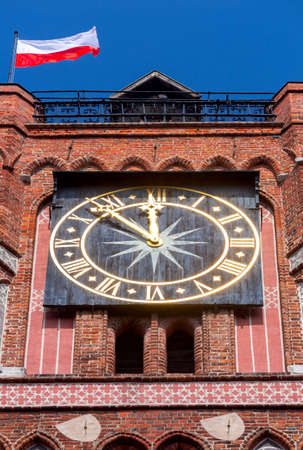Torun. The national flag of Poland on the tower of the City Hall.の写真素材