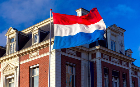 Netherlands. State national flag against a blue sky .の写真素材