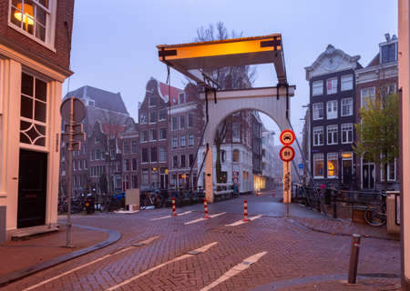 Old white drawbridge in the historic center of Amsterdam.の写真素材