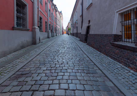 Poznan. Old traditional narrow city street at sunrise.の写真素材