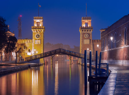Venice. Old stone towers of the arsenal over the canal in the early morning.の写真素材