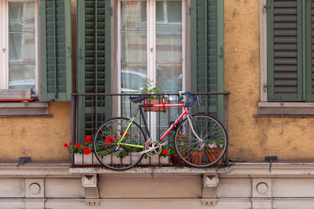 Zurich. A bright sports bike on the balcony of an old house.の写真素材