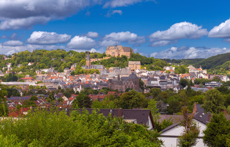 View of the castle on the mountain in the city of Marburg on a sunny summer morning.の写真素材