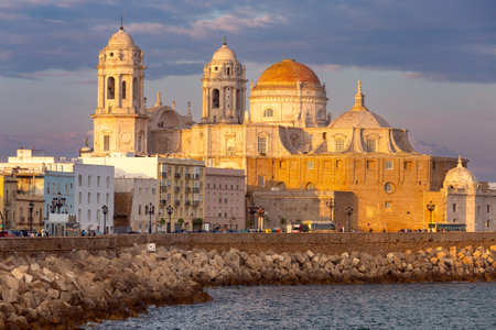 The building of the Cathedral of the Holy Cross in Cadiz at sunset. Spain. Andalusia.の写真素材