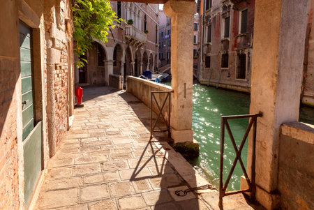 Venice. Old stone traditional houses over the canal.の写真素材