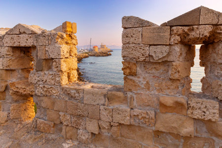 Old stone city wall in the city of Rhodes.