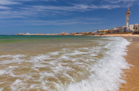Sandy city beach in Cadiz on a sunny day.の写真素材