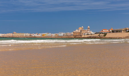 Sandy city beach in Cadiz on a sunny day.の写真素材