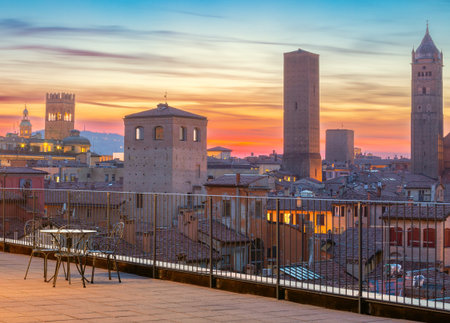 Old medieval towers at sunset in Bologna.